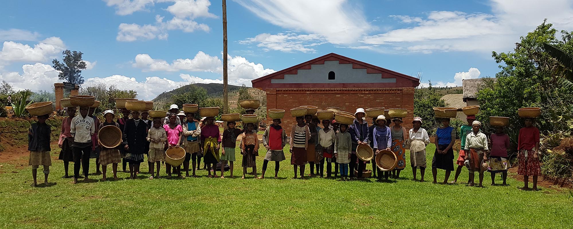 Community members gathered in front of the new school building