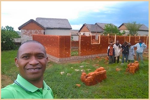 Community members working together on construction